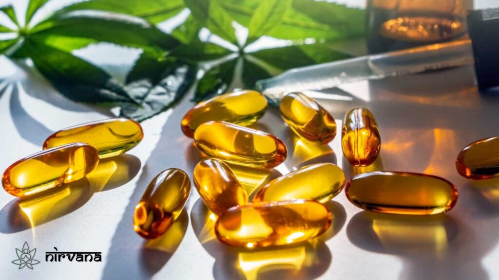 Golden cannabis capsules with hemp leaves in the background