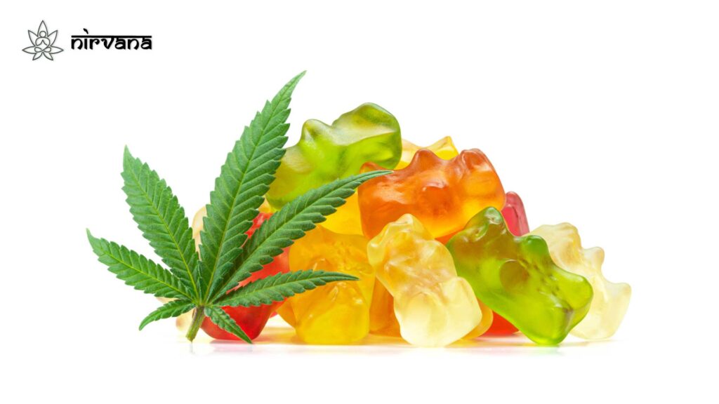 Pile of cannabis gummies and a hemp leaf