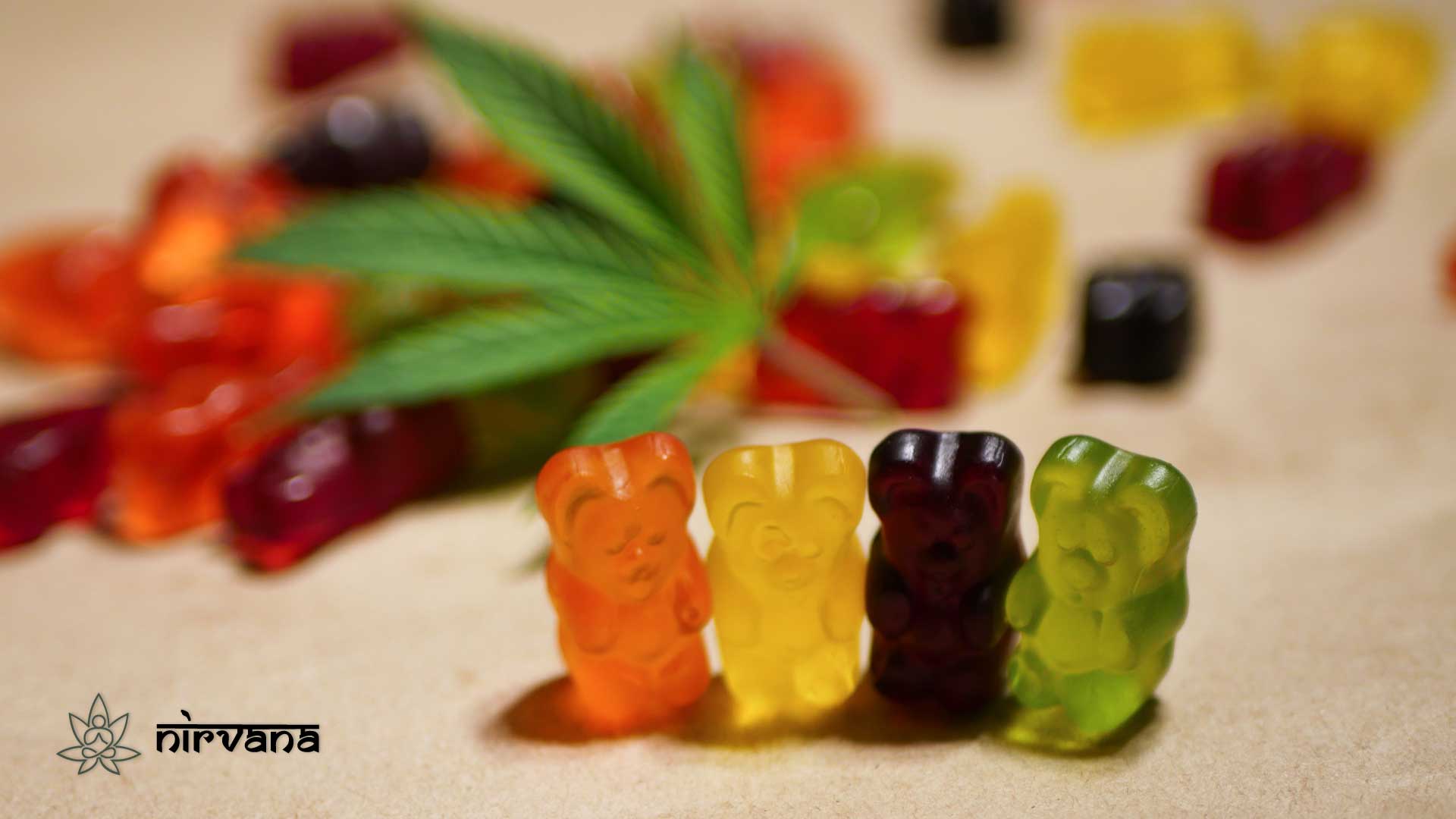 Colorful cannabis gummies with a hemp leaf